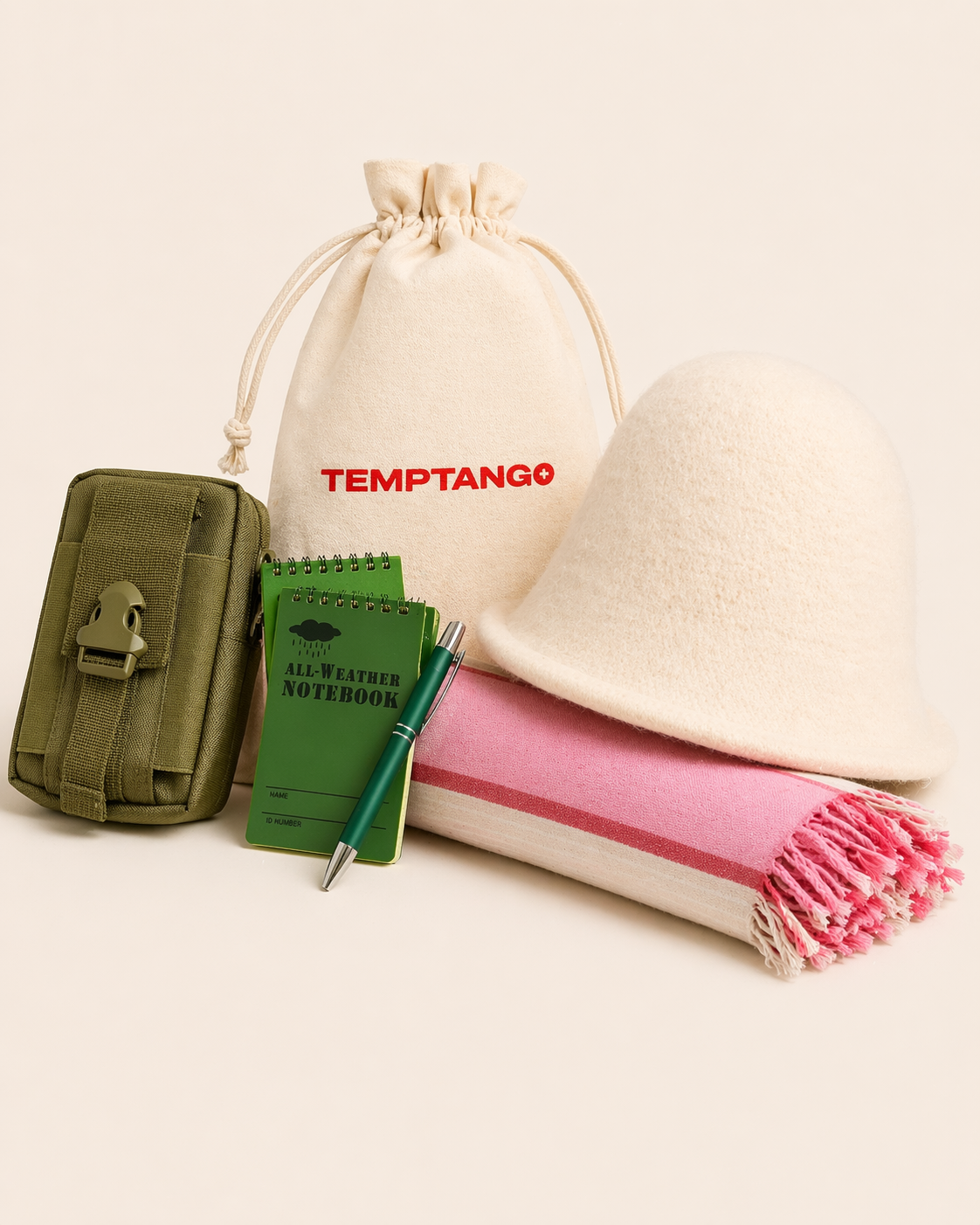 Green waterproof bag, waterproof notebook, pen, pink towel with a beige drawstring bag featuring 'Temptango' and a white sauna hat. Sauna essential bundle